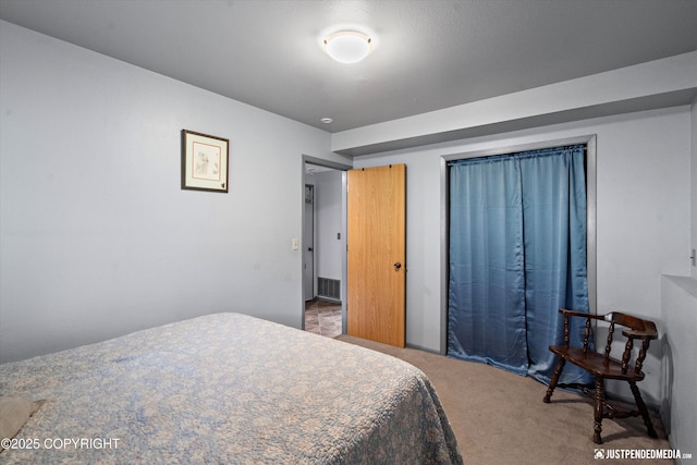 bedroom featuring carpet