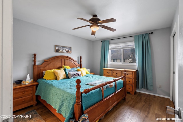 bedroom featuring wood finished floors, ceiling fan, and baseboards