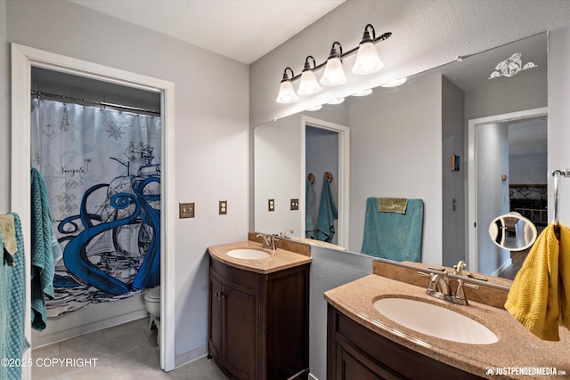 full bathroom featuring vanity, tile patterned flooring, toilet, and a shower with shower curtain