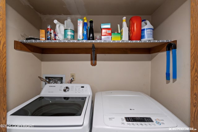 laundry room with washing machine and clothes dryer