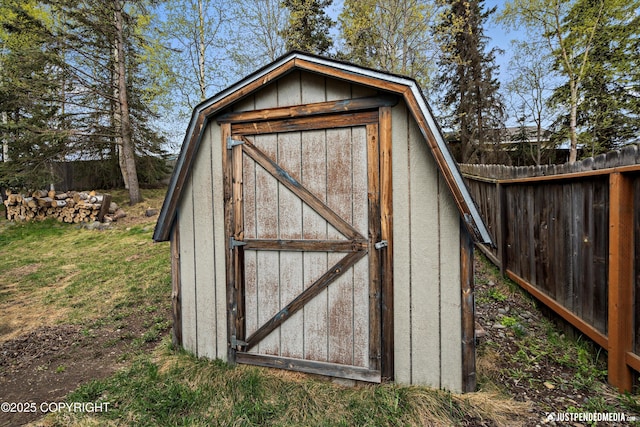 view of shed with fence