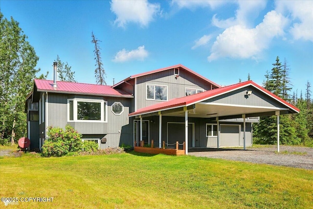 4035 S Tustin Dr, Palmer, AK 99645 - view of front of home featuring gravel driveway, a front lawn, metal roof, and a carport