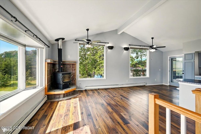 4035 S Tustin Dr, Palmer, AK 99645 - unfurnished living room with a ceiling fan, a baseboard heating unit, and dark wood finished floors