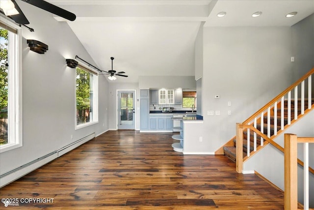 4035 S Tustin Dr, Palmer, AK 99645 - unfurnished living room featuring ceiling fan, a baseboard radiator, dark wood finished floors, a sink, and stairs