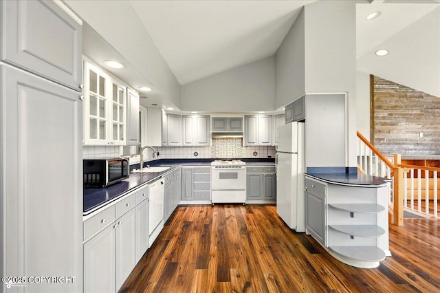 4035 S Tustin Dr, Palmer, AK 99645 - kitchen featuring white appliances, gray cabinets, dark countertops, lofted ceiling, and a sink