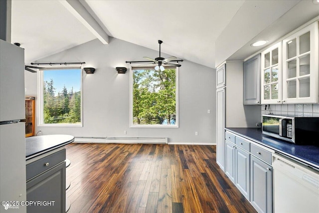 4035 S Tustin Dr, Palmer, AK 99645 - kitchen featuring white appliances, baseboard heating, a ceiling fan, dark wood-style flooring, and healthy amount of natural light