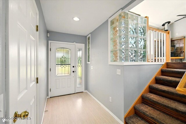 4035 S Tustin Dr, Palmer, AK 99645 - entrance foyer featuring baseboards, wood finished floors, stairway, and recessed lighting