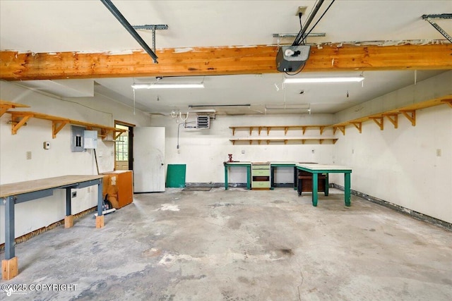 4035 S Tustin Dr, Palmer, AK 99645 - garage featuring a workshop area, a garage door opener, and electric panel