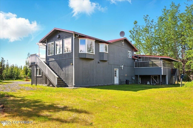 4035 S Tustin Dr, Palmer, AK 99645 - back of property featuring stairway, a sunroom, and a yard