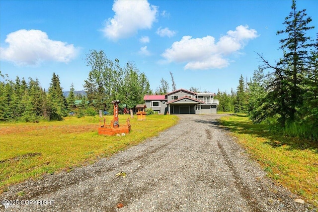 4035 S Tustin Dr, Palmer, AK 99645 - view of front of home with driveway, a front lawn, and an attached garage
