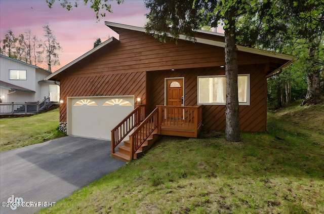 4320 Seeley Cir, Anchorage, AK 99502 - view of front of house with driveway, a garage, and a front yard