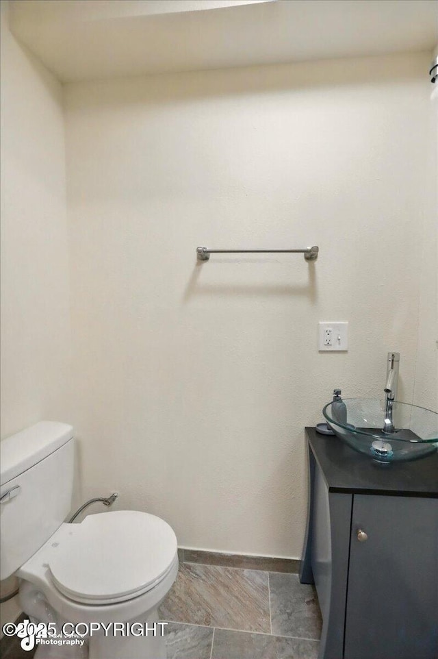 4320 Seeley Cir, Anchorage, AK 99502 - half bath with toilet, vanity, and baseboards