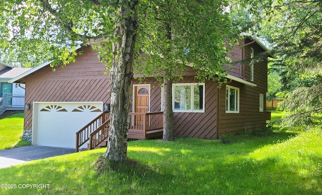 4320 Seeley Cir, Anchorage, AK 99502 - view of front of home with driveway, a front yard, and a garage