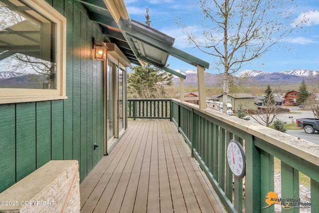 wooden terrace featuring a mountain view