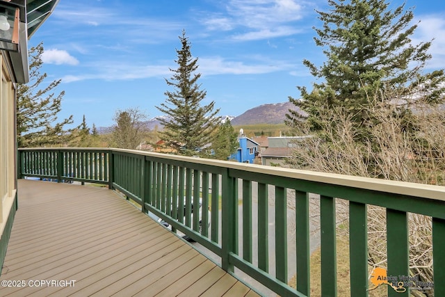 wooden deck with a mountain view