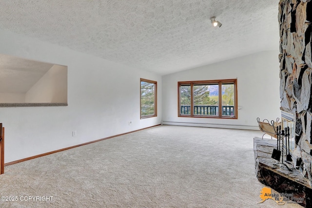 unfurnished living room featuring carpet floors, a baseboard radiator, vaulted ceiling, a textured ceiling, and baseboards