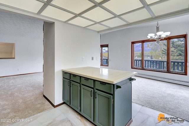 kitchen with green cabinets, light colored carpet, a baseboard heating unit, and a chandelier