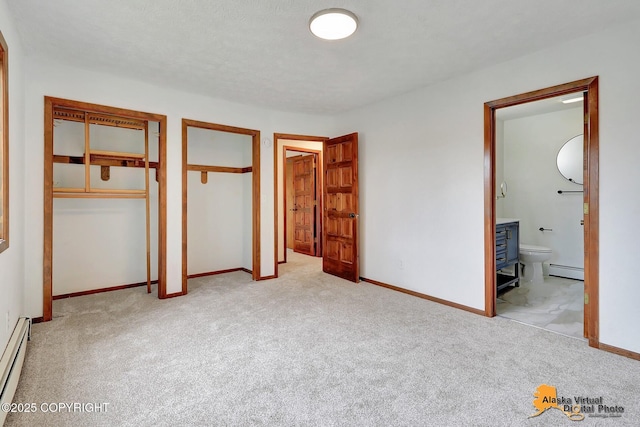 unfurnished bedroom with carpet, a baseboard radiator, and baseboards