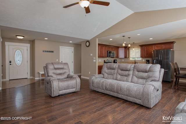 living room featuring a ceiling fan, lofted ceiling, dark wood finished floors, recessed lighting, and baseboards