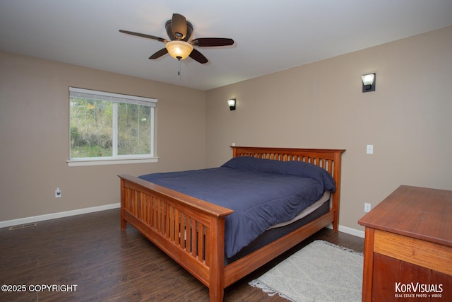 bedroom with baseboards, wood finished floors, and a ceiling fan