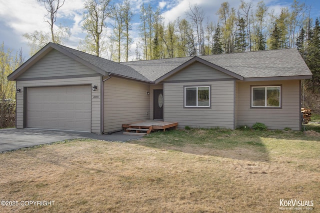 ranch-style home featuring an attached garage, asphalt driveway, roof with shingles, and a front lawn
