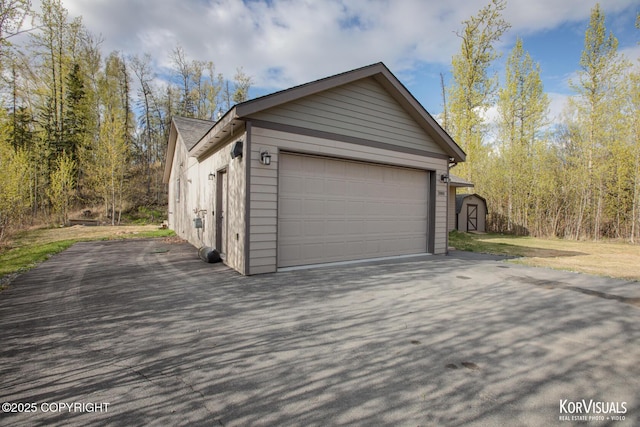 garage with a storage shed