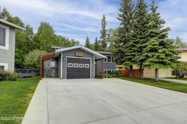 7810 Mae Rene Cir, Anchorage, AK 99502 - view of front of house with an attached garage and driveway
