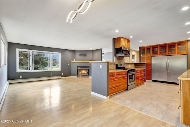7810 Mae Rene Cir, Anchorage, AK 99502 - kitchen featuring stainless steel appliances, baseboard heating, glass insert cabinets, light countertops, and recessed lighting