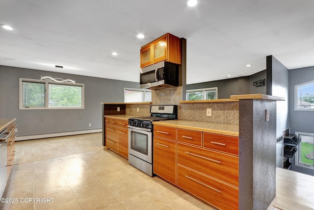 7810 Mae Rene Cir, Anchorage, AK 99502 - kitchen with stainless steel appliances, a baseboard heating unit, tasteful backsplash, recessed lighting, and light countertops