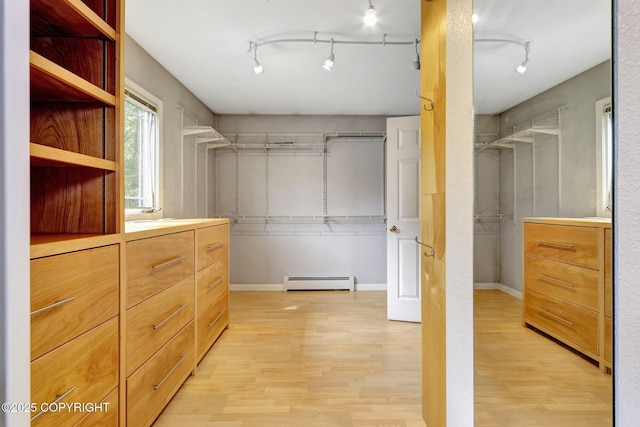 7810 Mae Rene Cir, Anchorage, AK 99502 - spacious closet with a baseboard heating unit and light wood-style floors