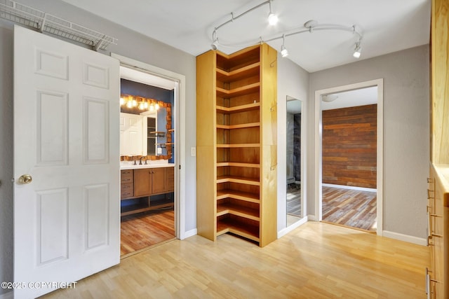 7810 Mae Rene Cir, Anchorage, AK 99502 - corridor with light wood-style floors, baseboards, and a sink