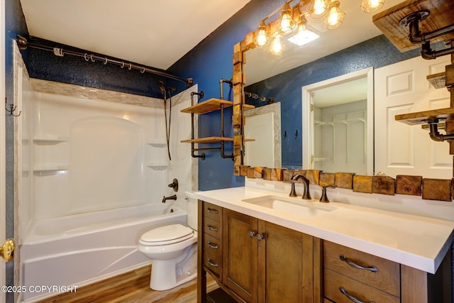 7810 Mae Rene Cir, Anchorage, AK 99502 - bathroom featuring vanity, toilet, bathing tub / shower combination, and wood finished floors