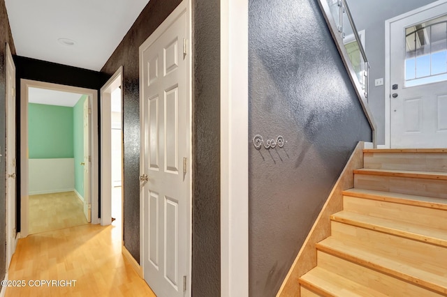 7810 Mae Rene Cir, Anchorage, AK 99502 - stairs with wood finished floors and baseboards
