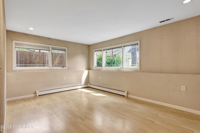 7810 Mae Rene Cir, Anchorage, AK 99502 - unfurnished room with wood finished floors, baseboards, and recessed lighting