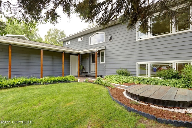 7810 Mae Rene Cir, Anchorage, AK 99502 - rear view of house featuring a lawn