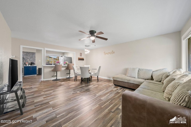1507 W 47th Ave, Anchorage, AK 99503 - living area with wood finished floors, a ceiling fan, and a textured ceiling