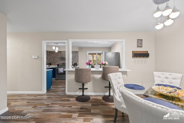 1507 W 47th Ave, Anchorage, AK 99503 - dining space with dark wood-style floors and baseboards