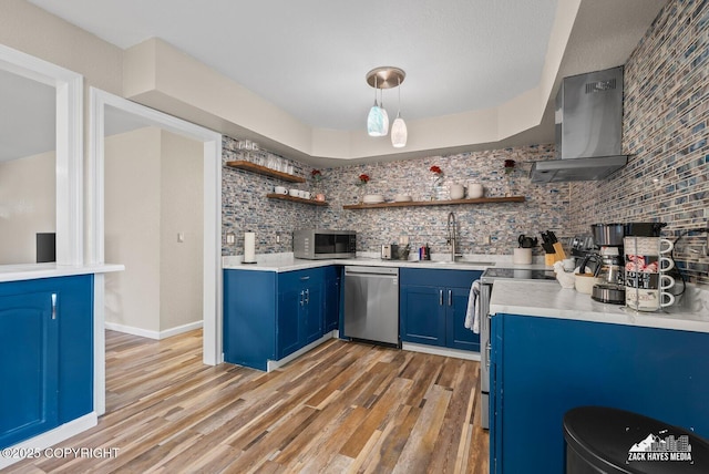 1507 W 47th Ave, Anchorage, AK 99503 - kitchen with blue cabinetry, stainless steel appliances, wall chimney exhaust hood, and open shelves