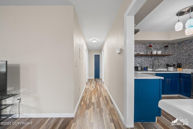 1507 W 47th Ave, Anchorage, AK 99503 - hall with a textured wall and light wood-style floors