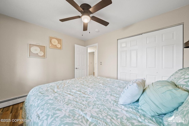 1507 W 47th Ave, Anchorage, AK 99503 - bedroom featuring dark wood-style floors, a closet, ceiling fan, and a baseboard heating unit