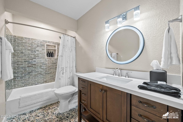1507 W 47th Ave, Anchorage, AK 99503 - bathroom featuring shower / tub combo, vanity, and a textured wall