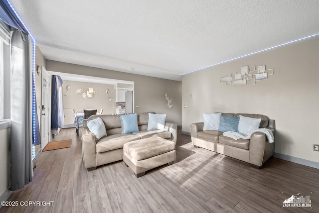 1507 W 47th Ave, Anchorage, AK 99503 - living area featuring wood finished floors, a textured ceiling, and a chandelier