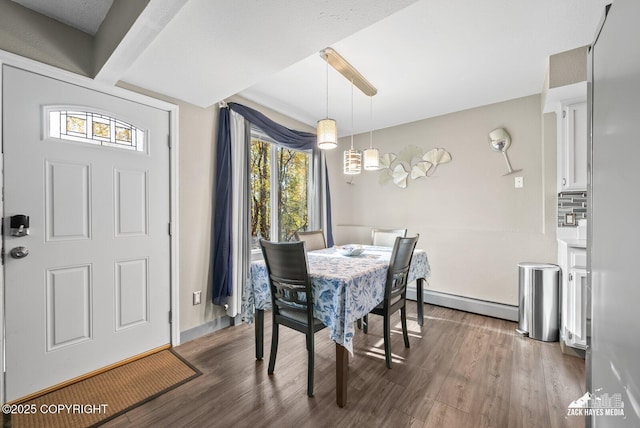 1507 W 47th Ave, Anchorage, AK 99503 - dining area with a baseboard heating unit and wood finished floors