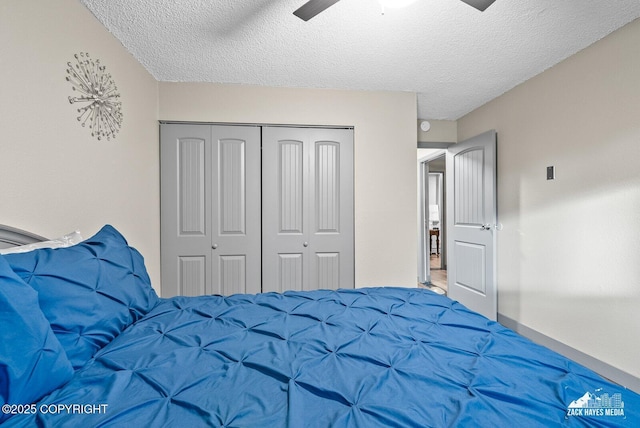 1507 W 47th Ave, Anchorage, AK 99503 - carpeted bedroom with a closet, a textured ceiling, and a ceiling fan
