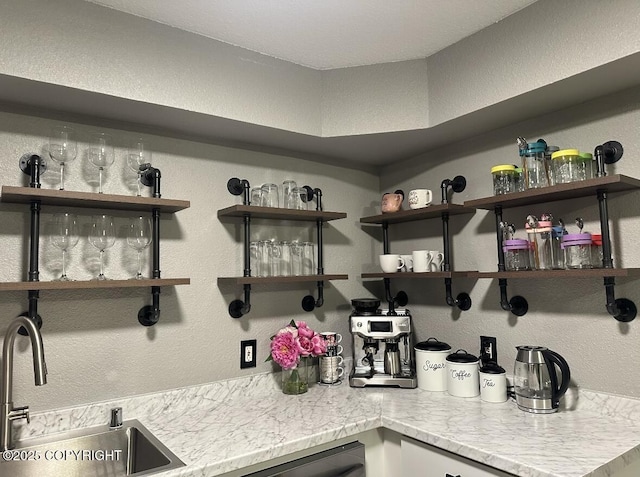 1507 W 47th Ave, Anchorage, AK 99503 - bar featuring a textured wall and stainless steel dishwasher