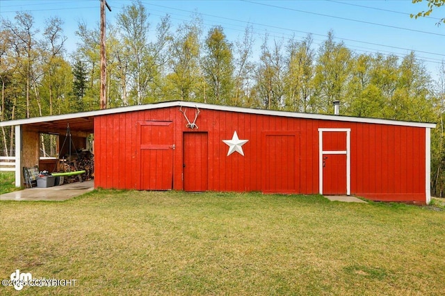 view of pole building with a lawn