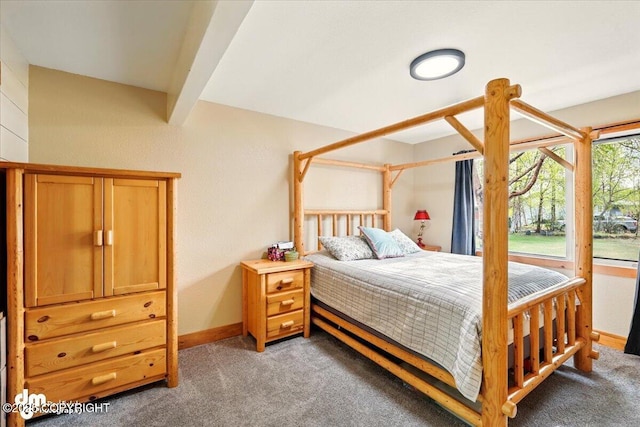 bedroom featuring light colored carpet and baseboards