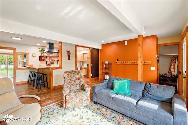 living room with wood finished floors and recessed lighting