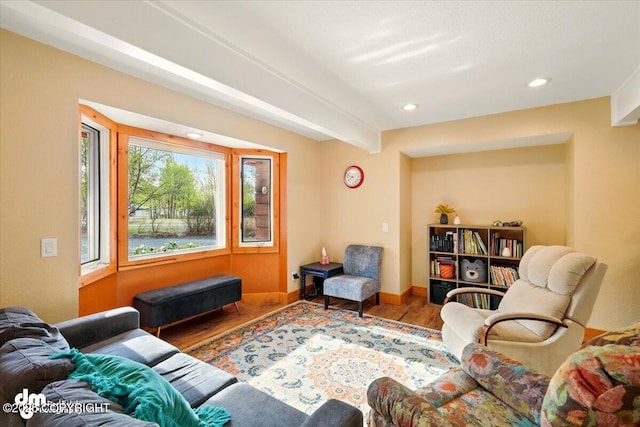 living area featuring wood finished floors, recessed lighting, and baseboards