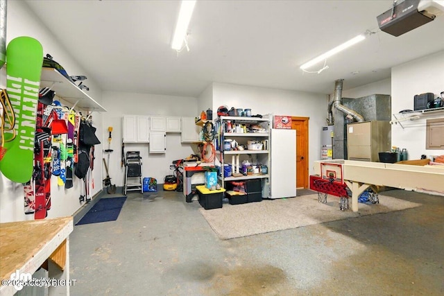 garage featuring a garage door opener, a workshop area, and heating unit